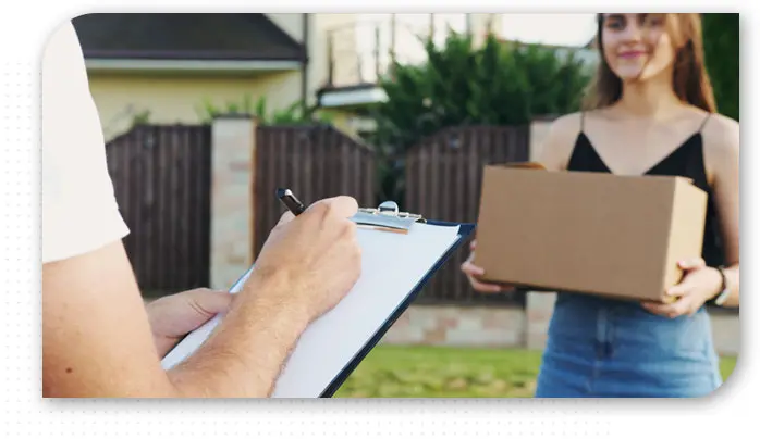 Delivery Boy Delivering Package To Woman